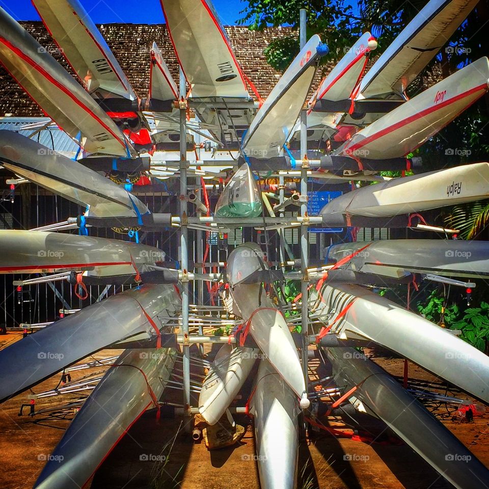 Outriggers canoes projecting from storage rack