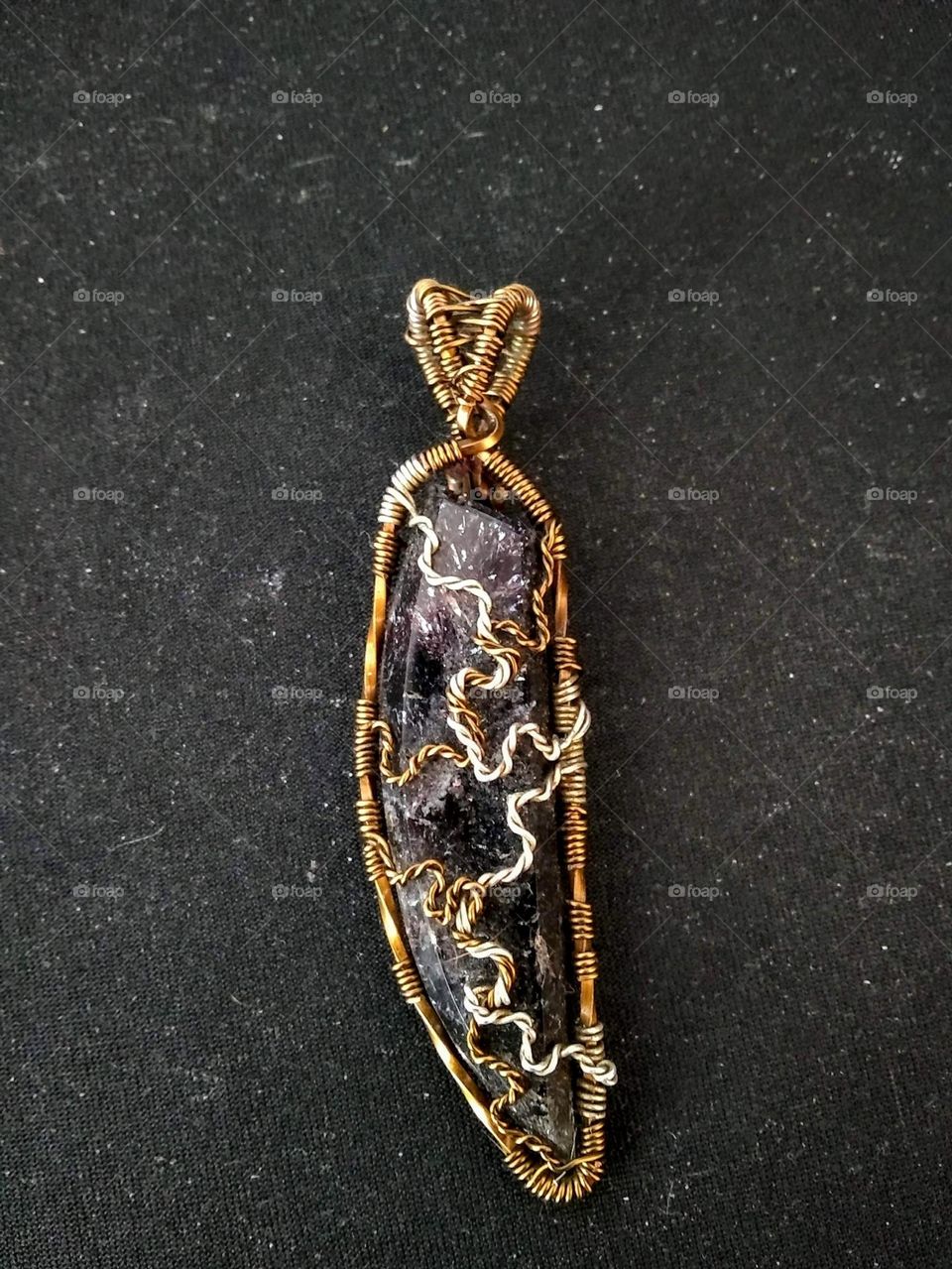 Super seven stone wrapped in bronze