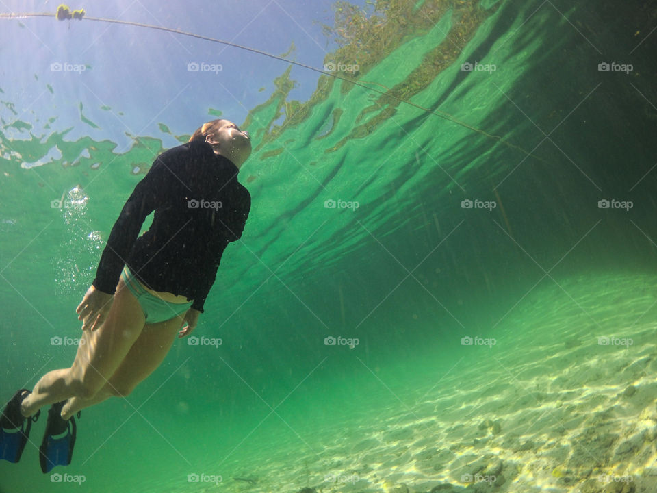 Underwater shot of lady swimming