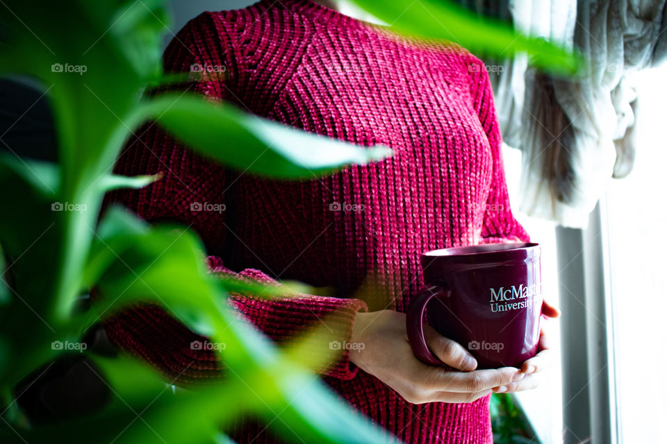 relaxing on verge of winter with a hot drink and a cosy sweater as it snows out side, happiness can be found in gratitude of little things in life