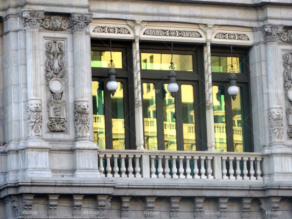 reflection on an old building in Madrid