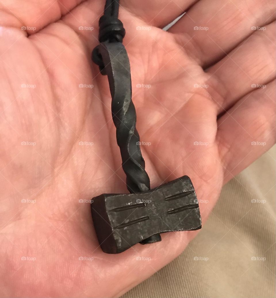 A Thor Mjolnir pendant.