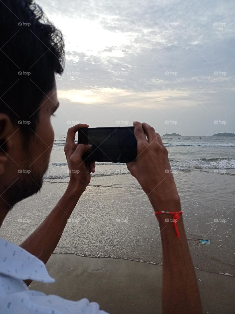 Yang man enjoying sunset