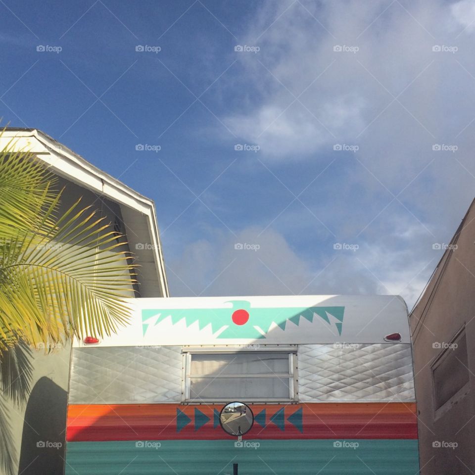 Urban camping in San Diego vintage trailer in driveway