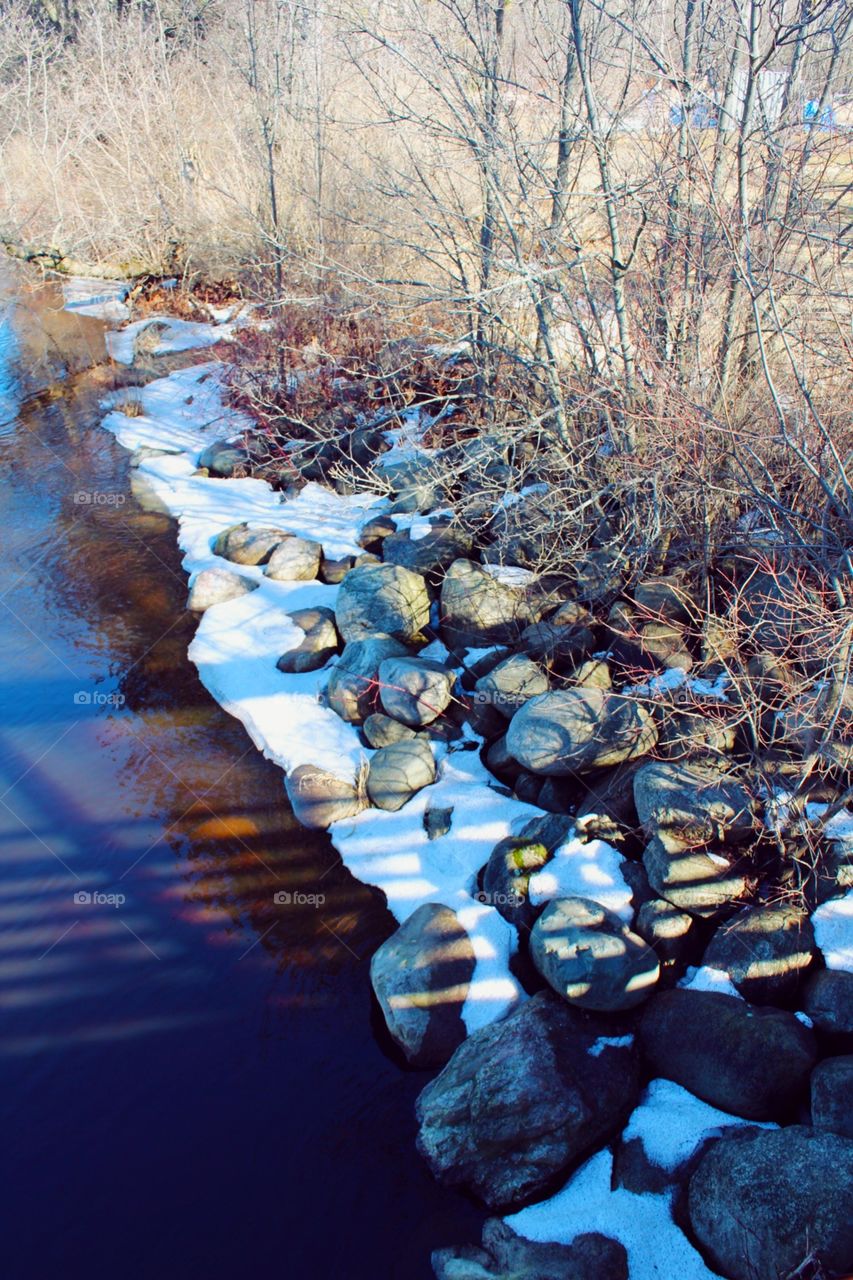 Snow river bank