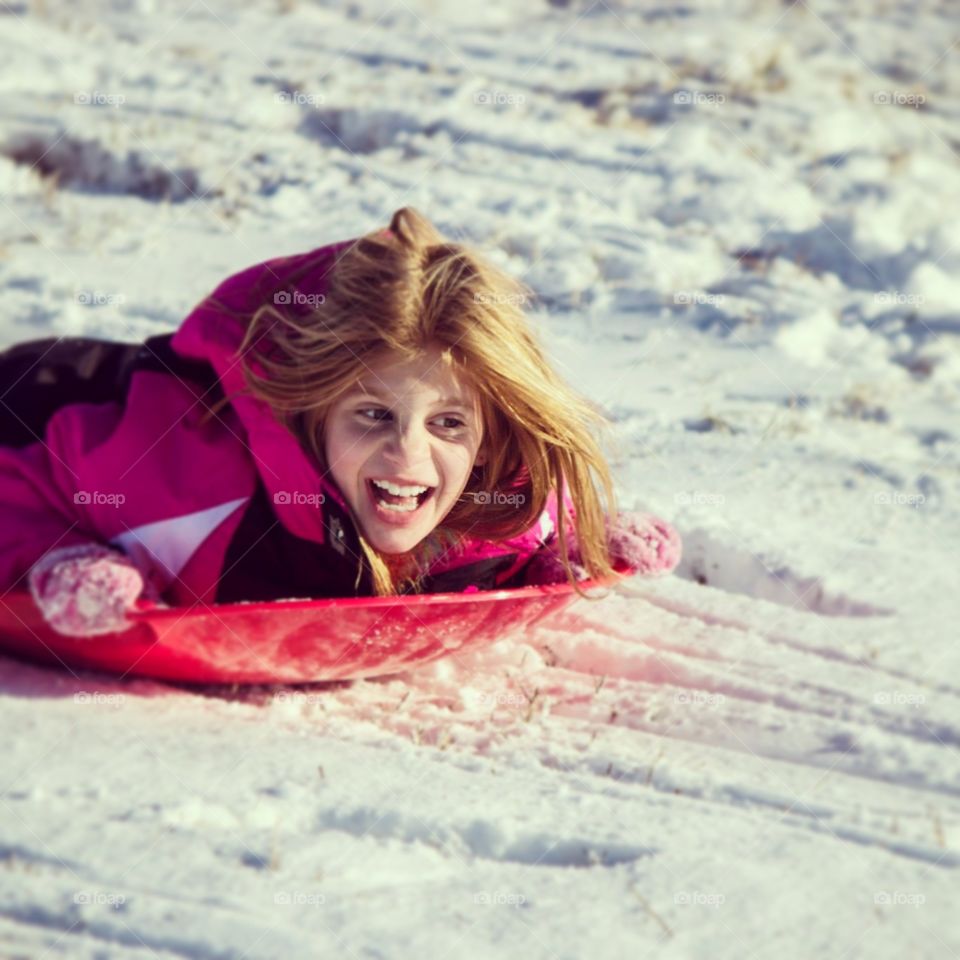 Joy. My daughter sledding in Oklahoma