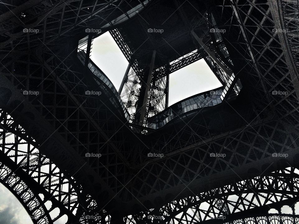 Eiffel Tower from below. black and white photo to the Eiffel Tower from below 