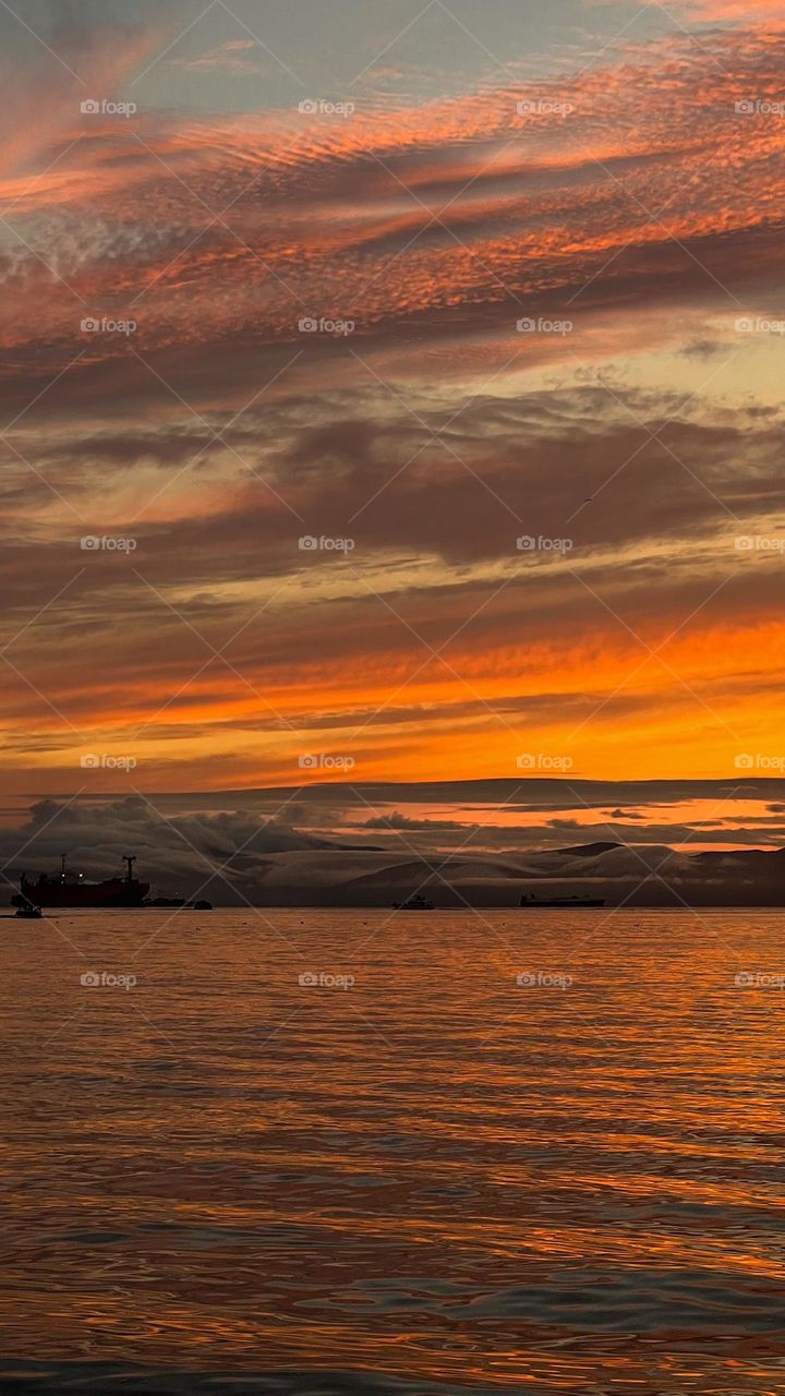 Orange sunset and fairy clouds