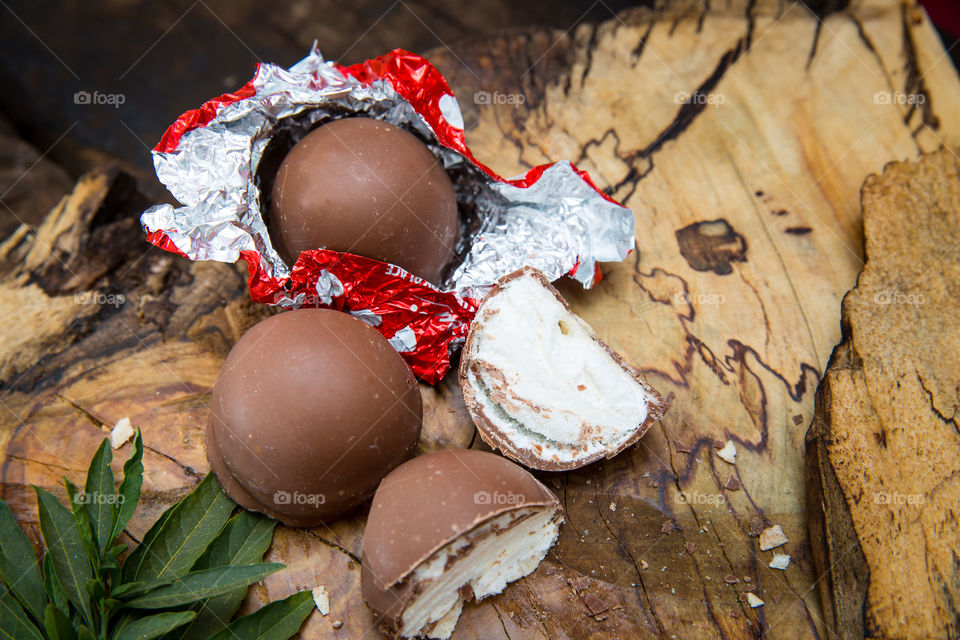 Sweet tooth! I love sweetie pies, a chocolate coated marshmallow! Image of chocolates on wood.