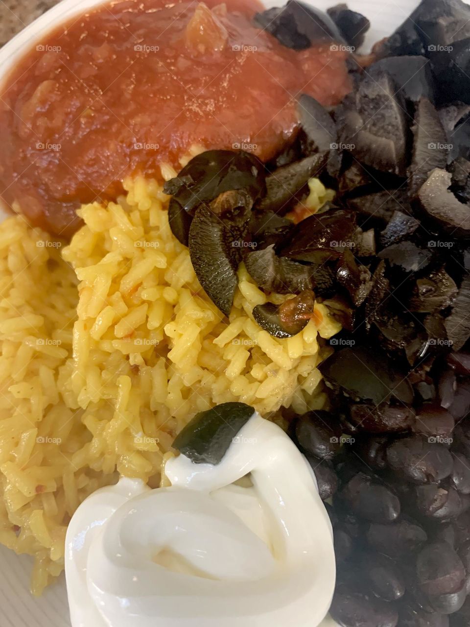 Black beans and yellow rice crema and salsa 