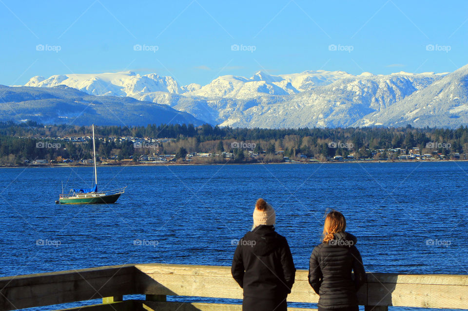 It was a beautiful sunny winter day which is rare on the Pacific North ‘wet’ Coast. It was relatively cold for our standards and cloudless which made for some awesome mountain vistas. This shot was taken from a waterfront pier. Stunning!