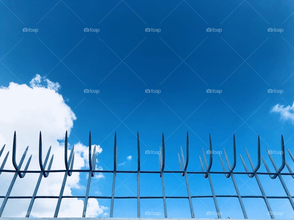 Fence against blue sky 