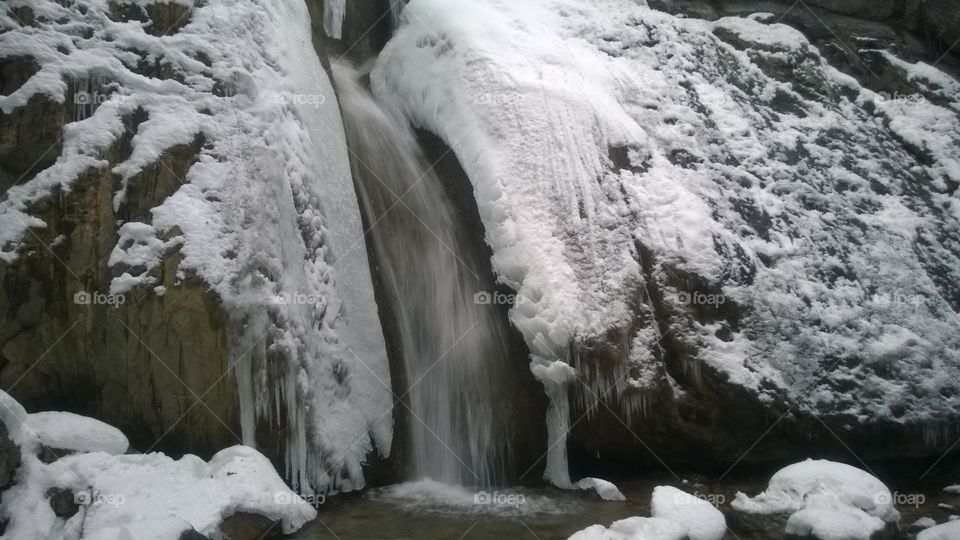 Scenic view of waterfall during winter