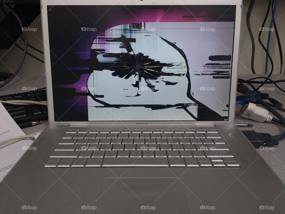 Mac laptop with broken screen.
