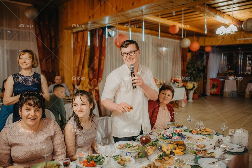 The moment of raising a toast for the bride and groom