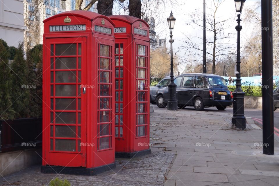 Red cabin and black cab
London
UK