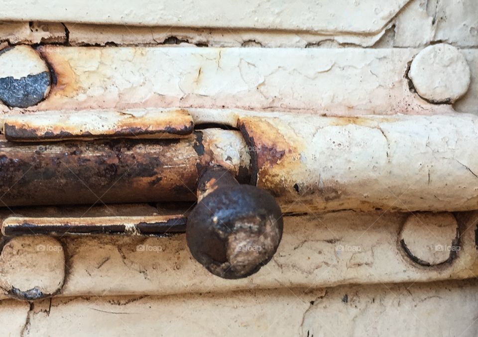 Antique rusty painted sliding door latch closeup