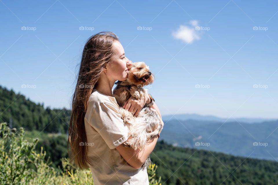 woman hiking with her dog