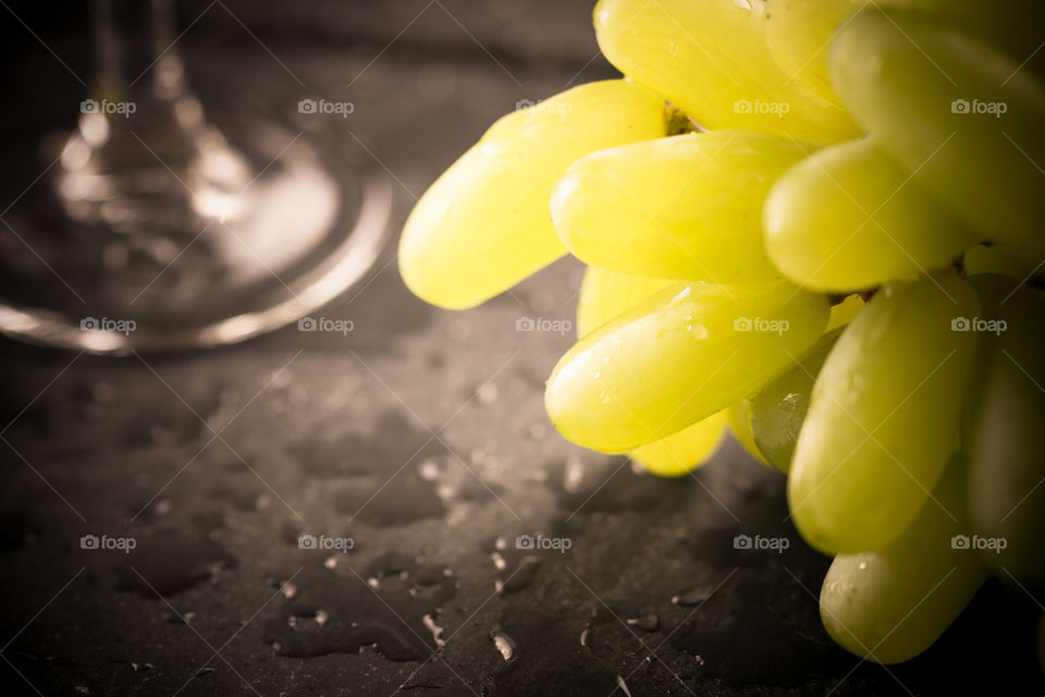 Grapes and Wine glass in bright sunlights