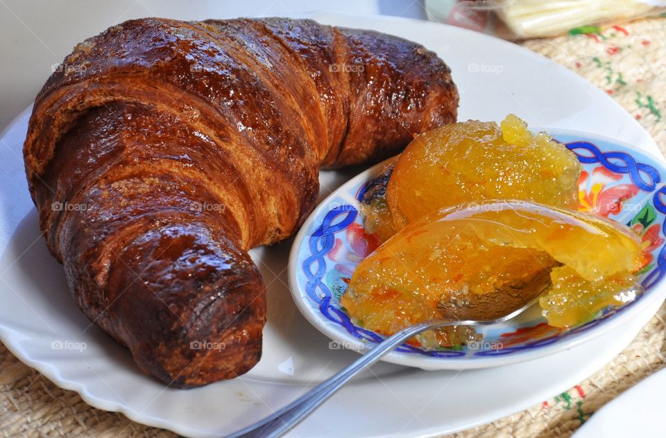 Croissant with orange jam