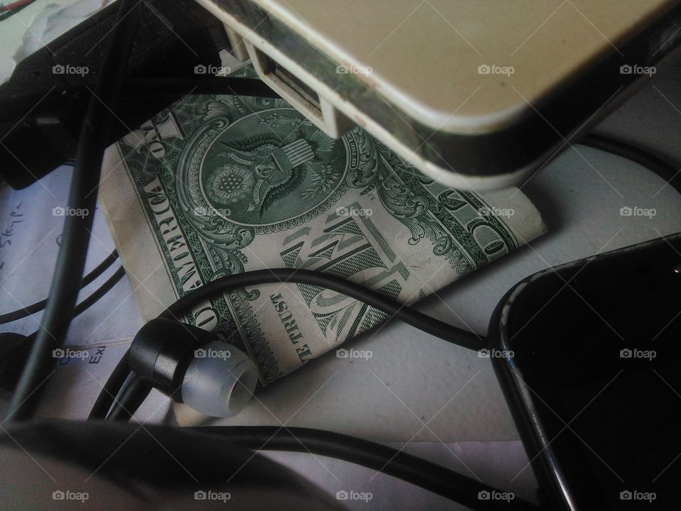 One Dollar bill under my laptop