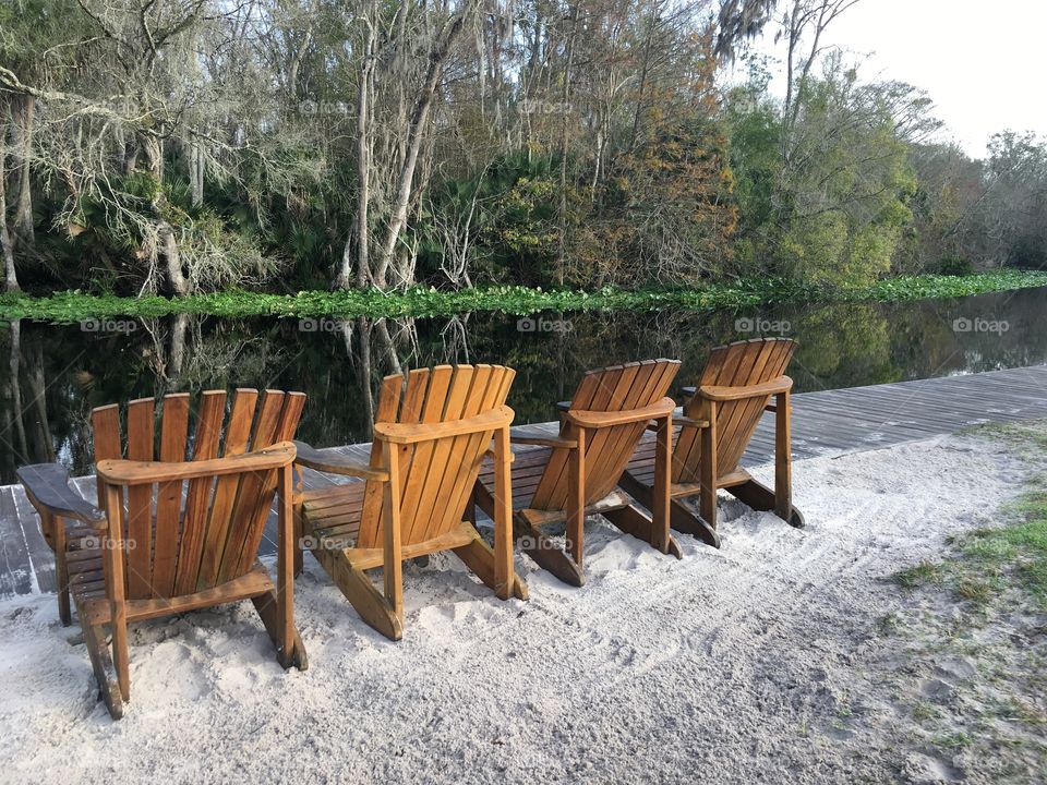 Wooden beach chairs at sea