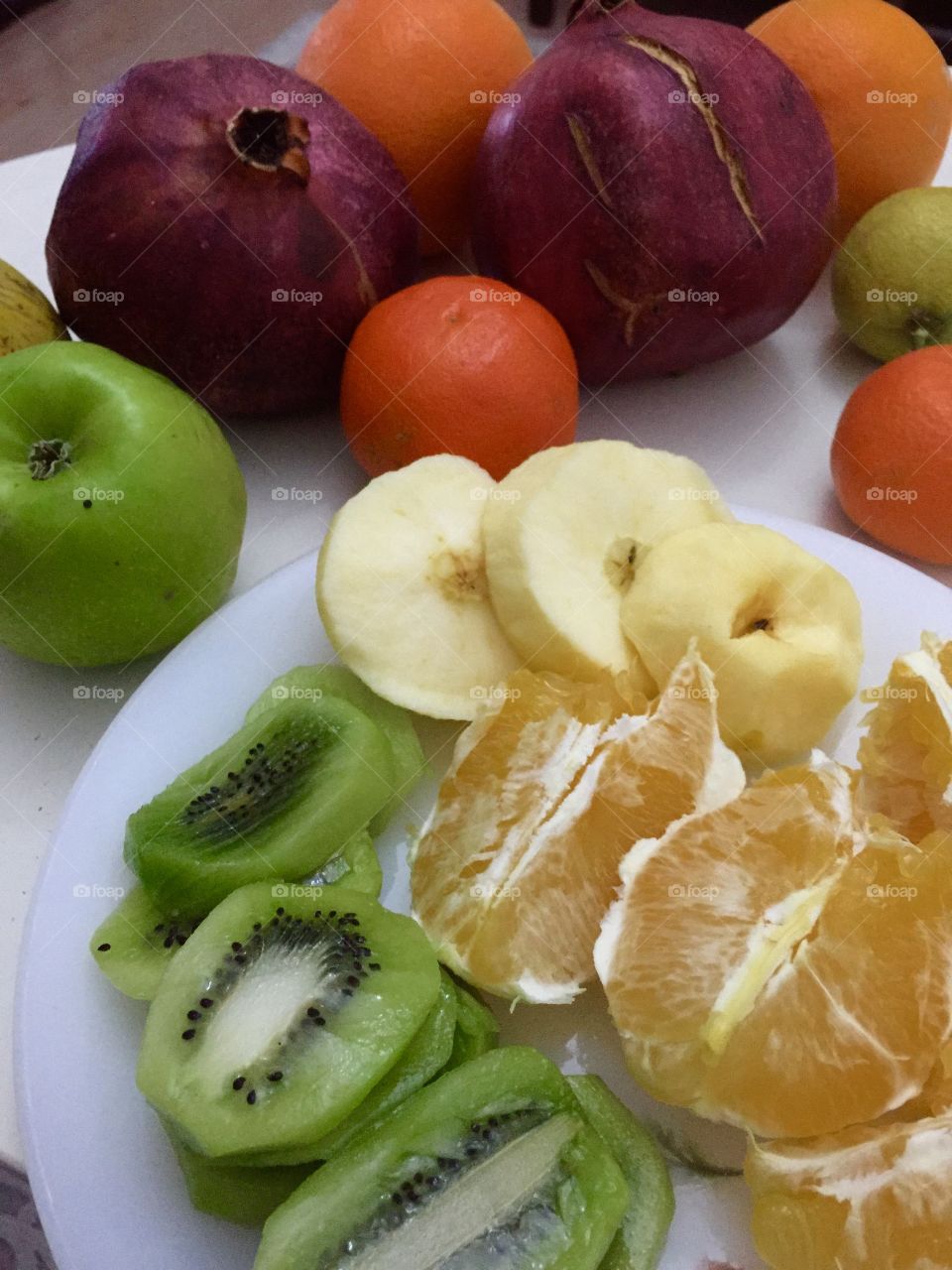 Variety of fruits slices on plate