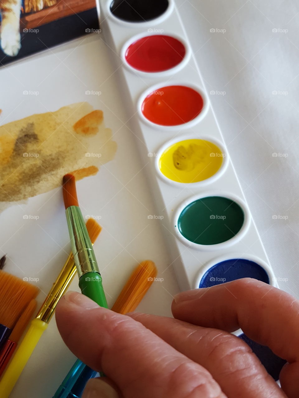 Watercolor painting with paintbrush