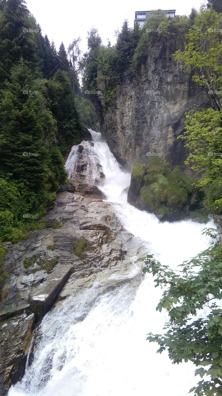 Bad Gastein, Austria, waterfall cascade at city, rock mountain, landscape on waterfall