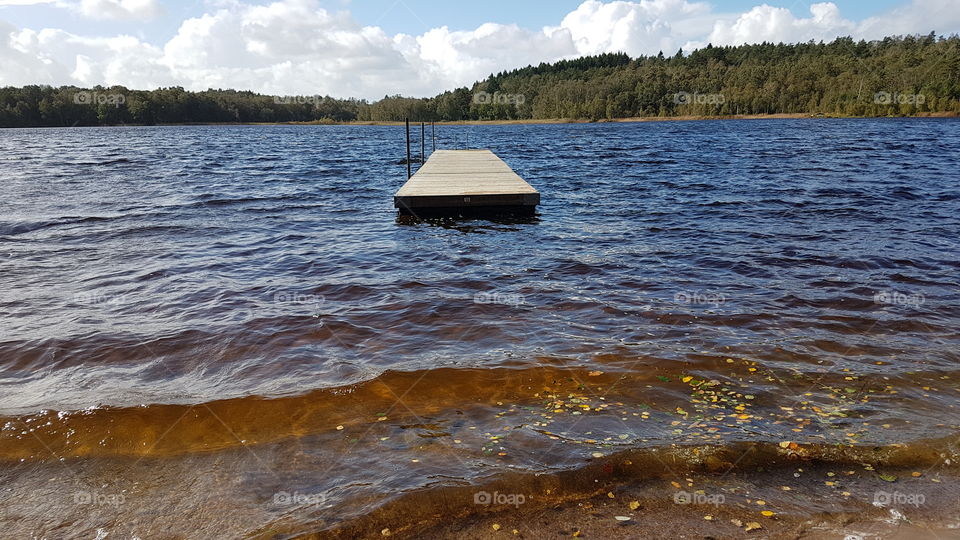 Empty jetty in small lake in the fall , tom badbrygga höst Härlanda Tjärn Sverige 