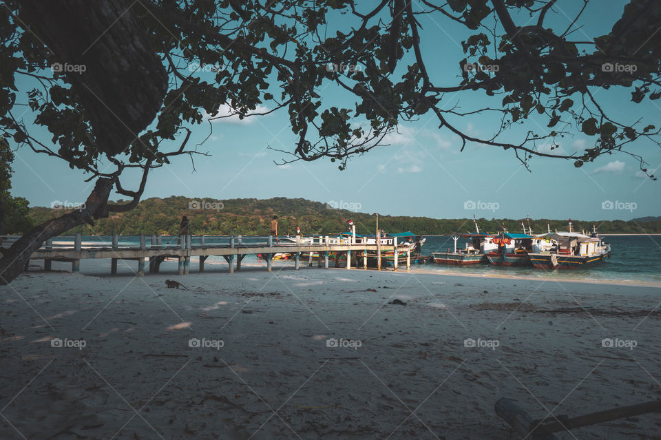 Peucang island, one of the famous island in Ujung Kulon National Park Indonesia, beautiful lanscape of white sandy beach and clear blue sky