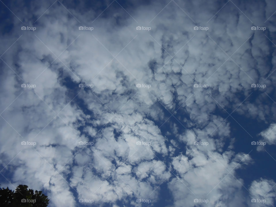 Puffy Clouds Across Sky