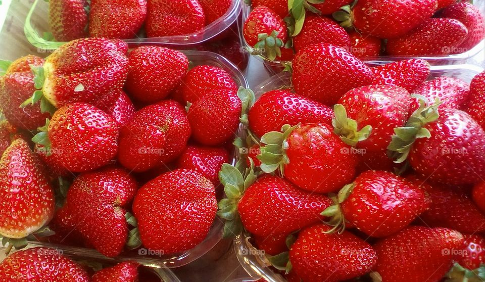 Red fresh strawberries in market