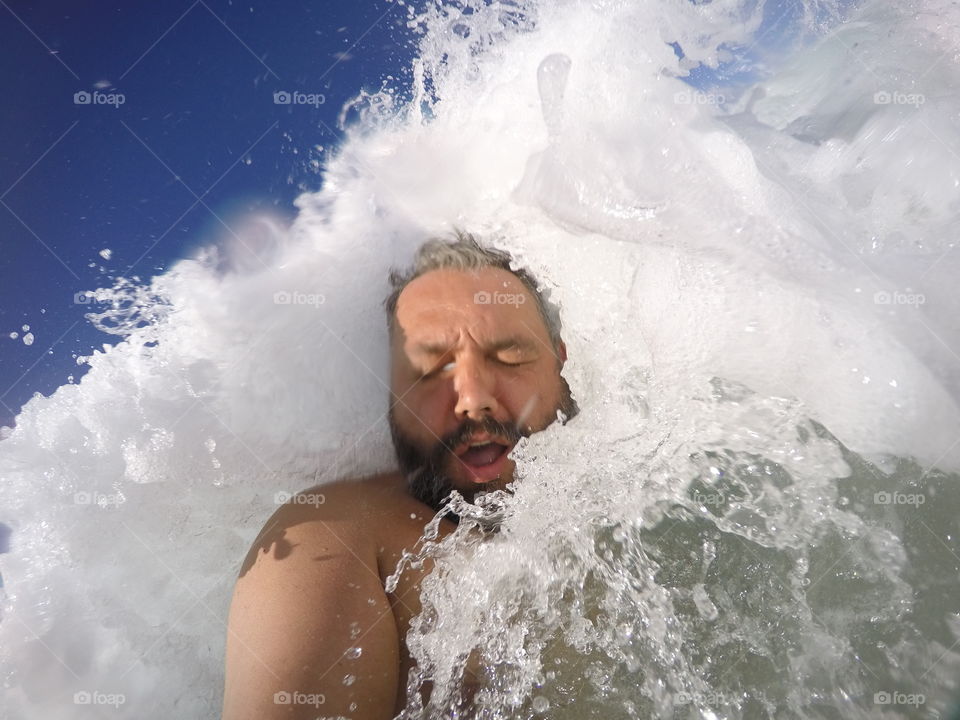 Close-up of man swimming in sea