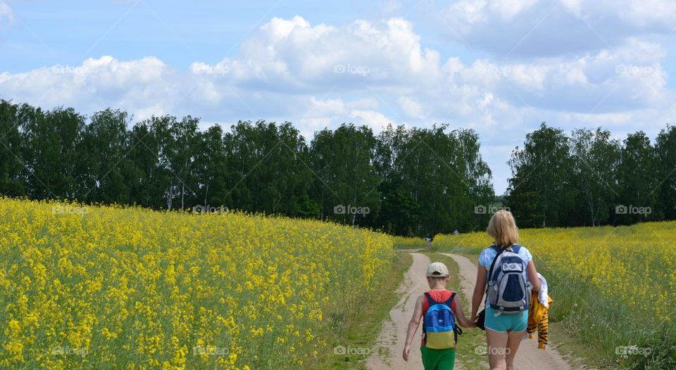 family mother and son walking outdoor summer time