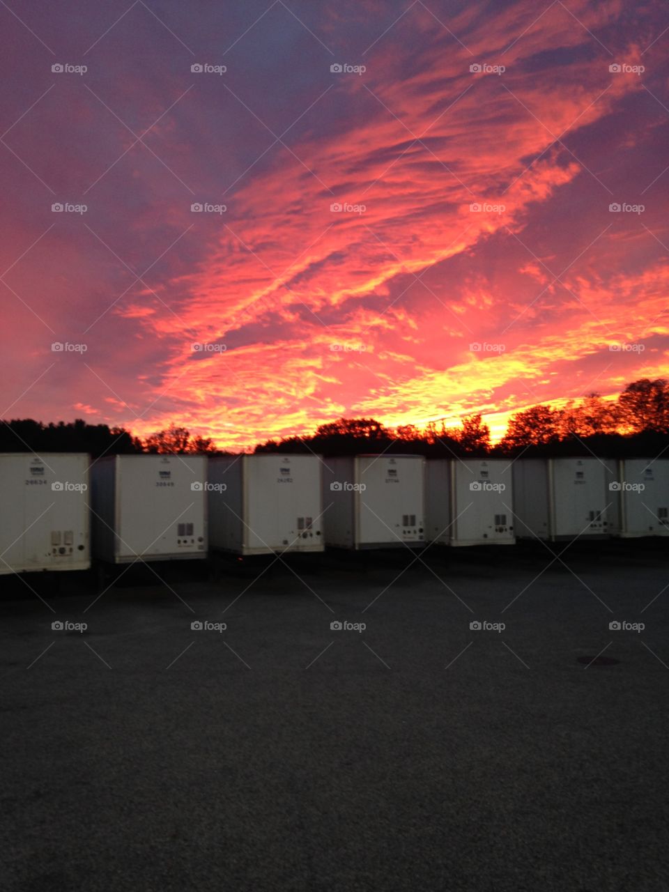 Sunset over semi-trailers 