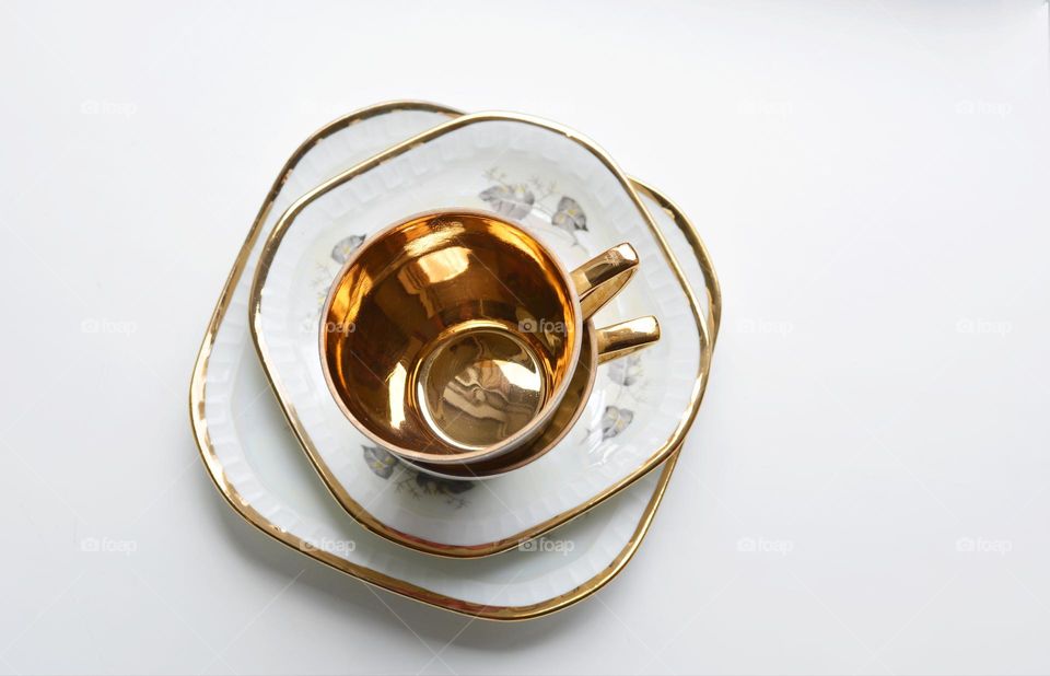 object golden cups top view on a white background