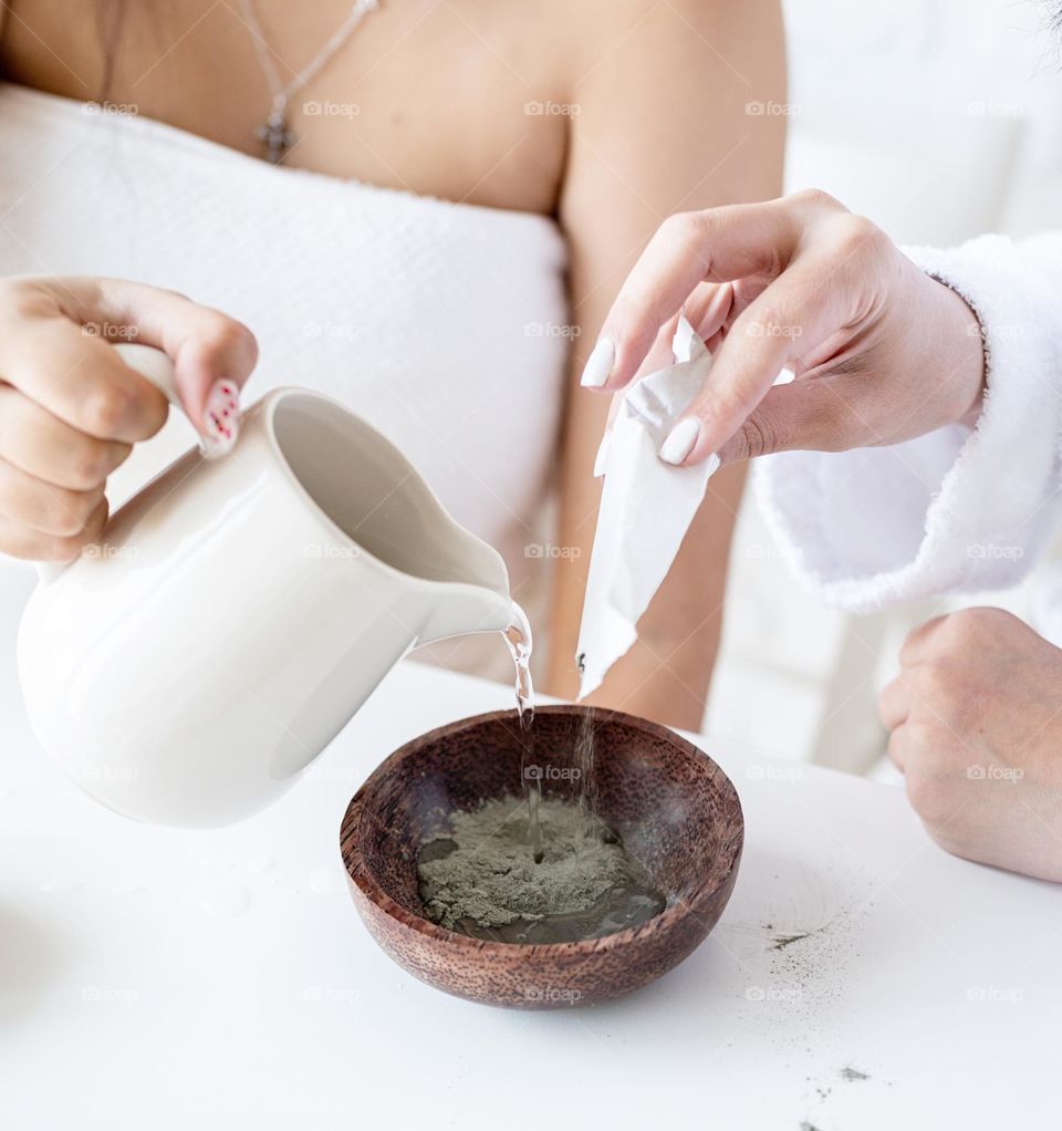 woman hand holding beauty products