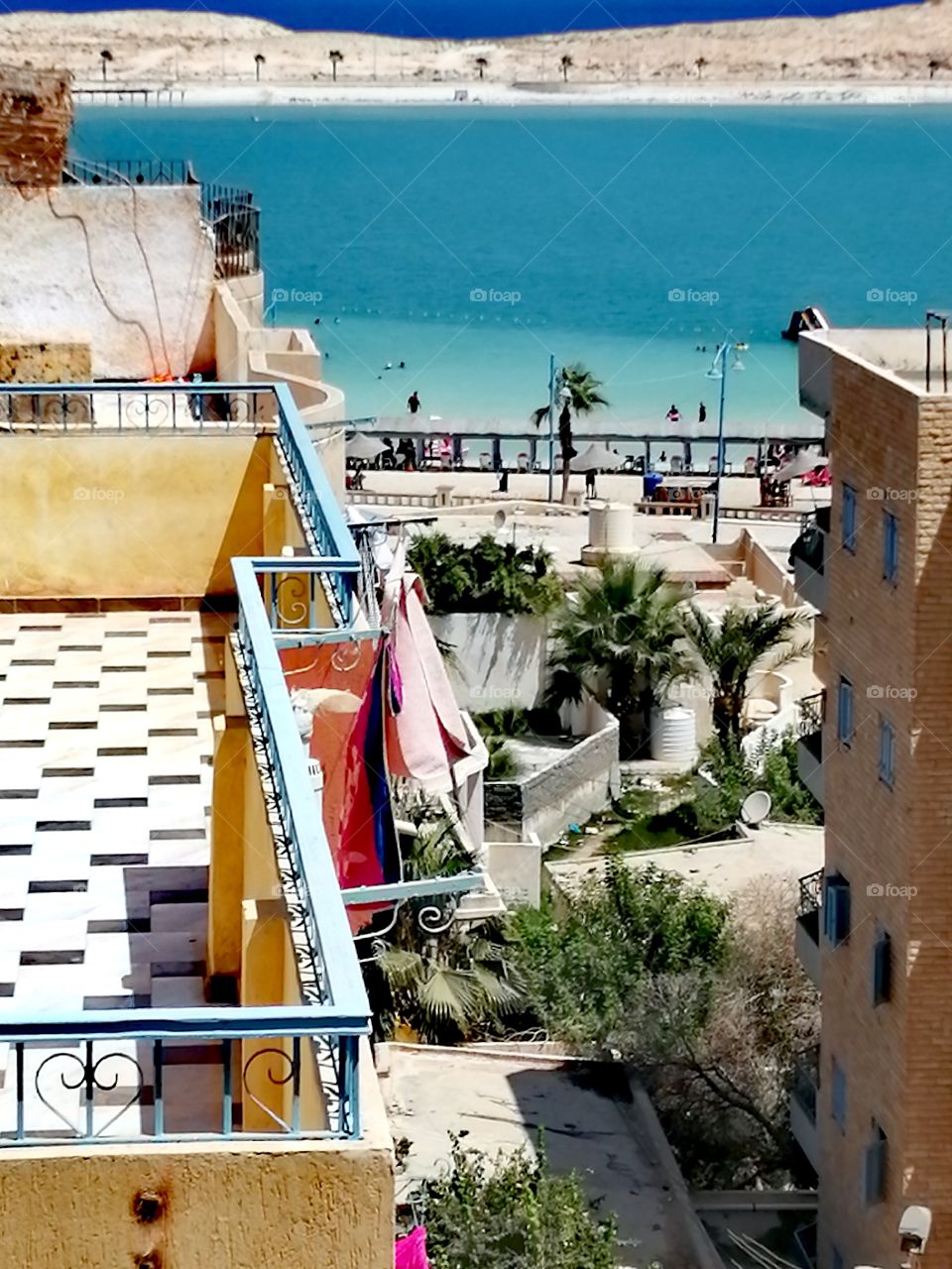 Marsa Matrouh sea with a view of the beach, trees and buildings