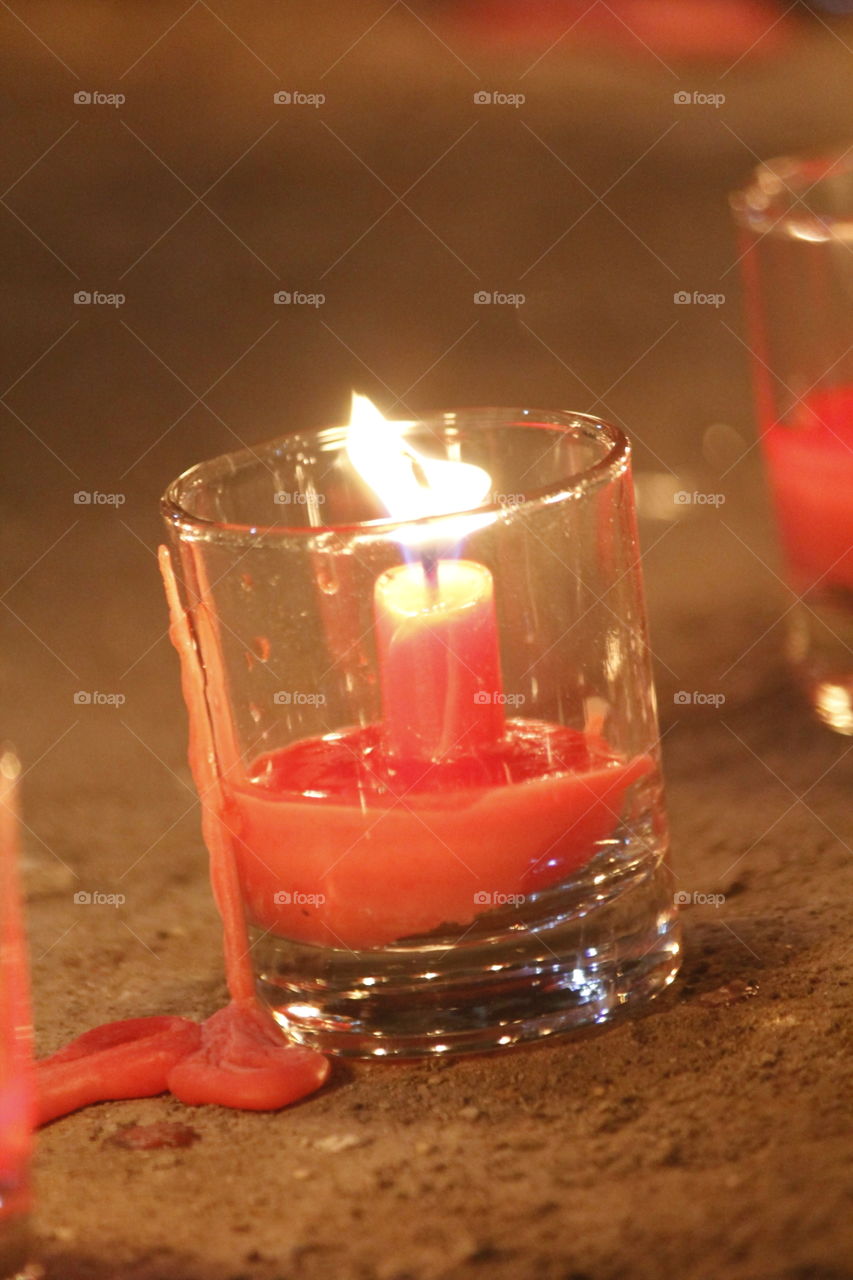 red candle light in glasses
