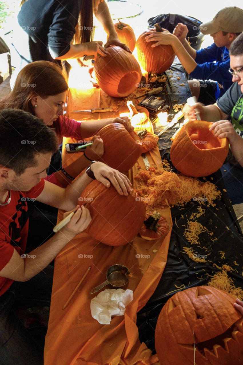 People carving pumpkins 