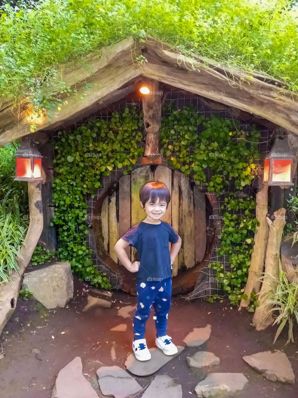 handsome asian boys stand in front of various design plants