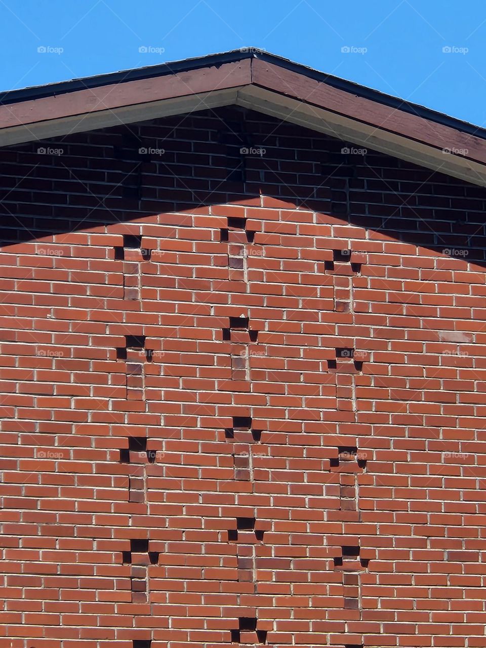 engraved cross pattern brick wall of Oregon church