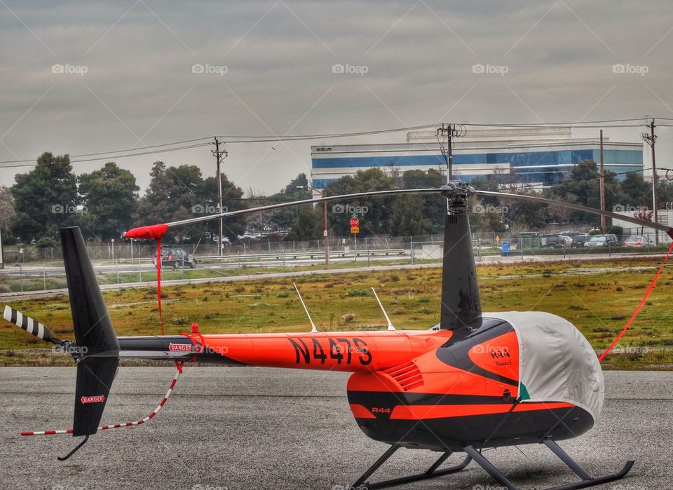 Ready For Flight. Helicopter Parked On Airport Tarmac
