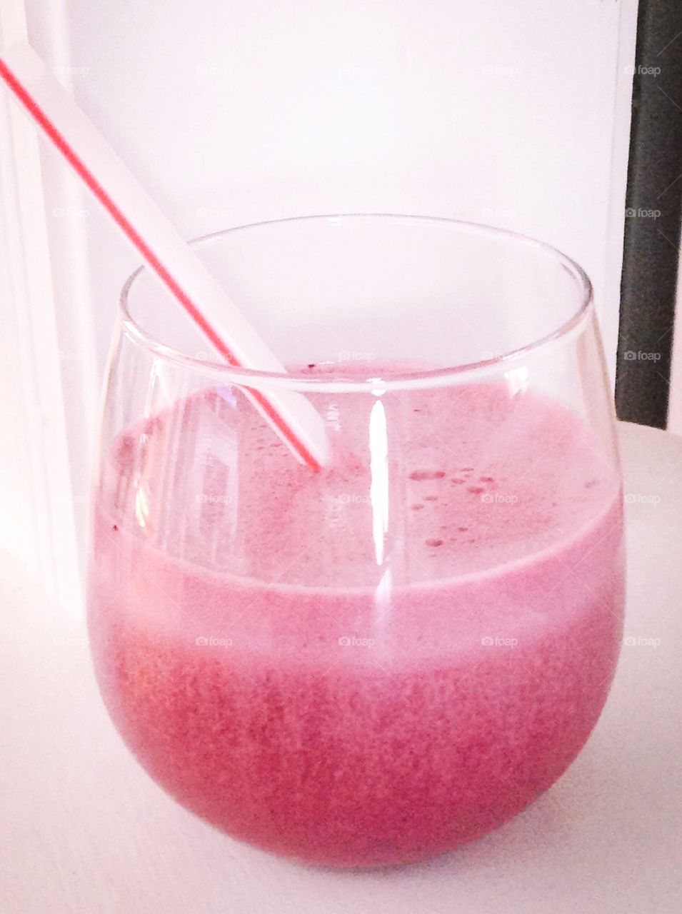 Delicious pink strawberry smoothie for good health.