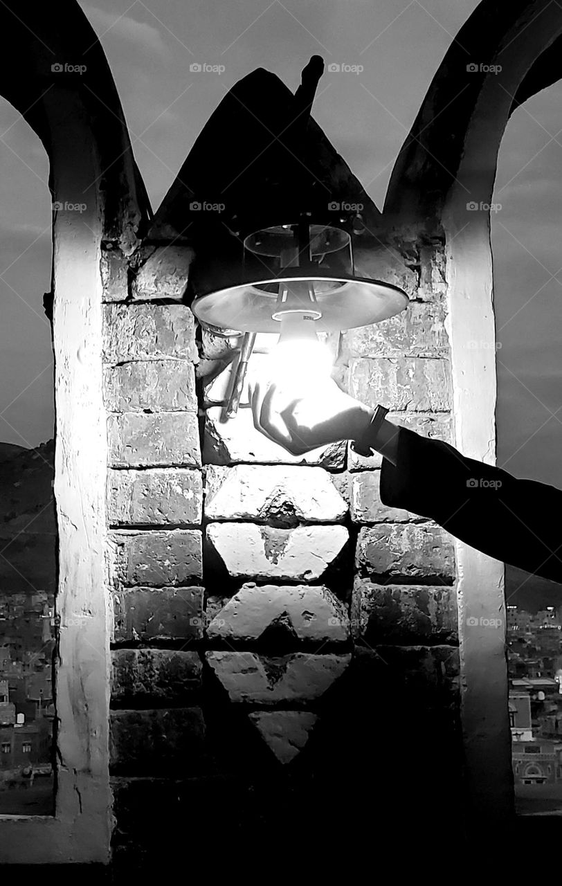 hand under the lamp light