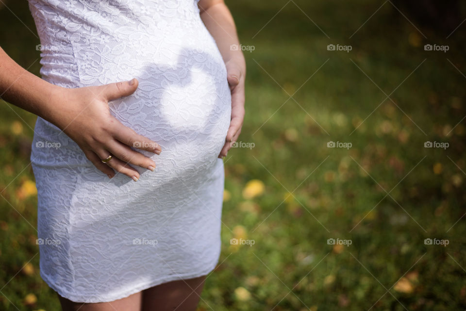 Heart shape on pregnant women's belly