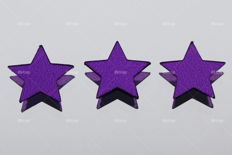 Three purple stars reflections 