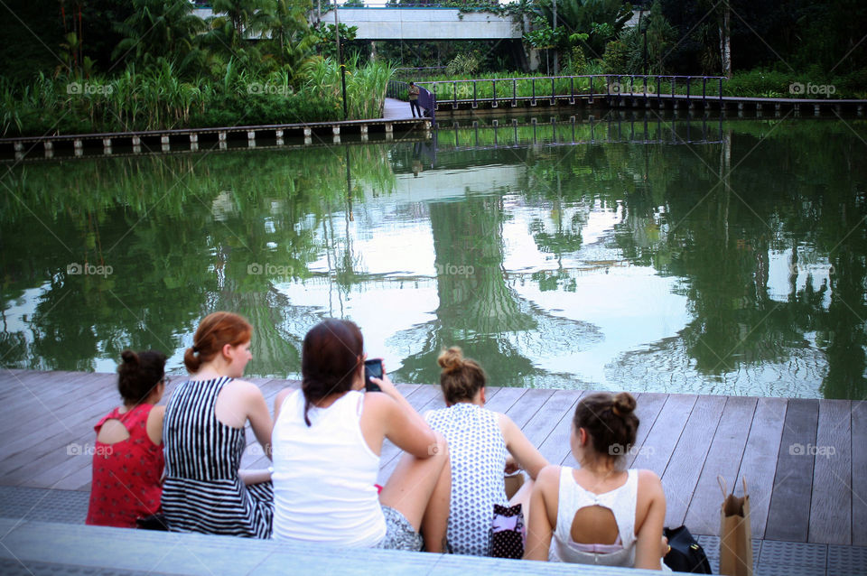 Women relaxing by the river