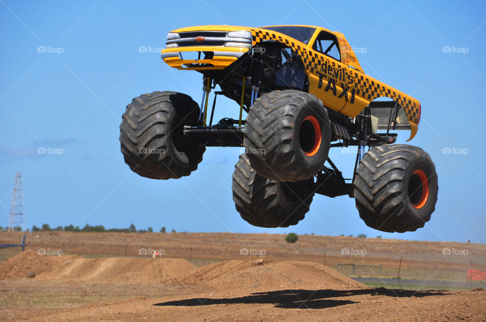 Monster truck doing a jump during the 2013 Australian International